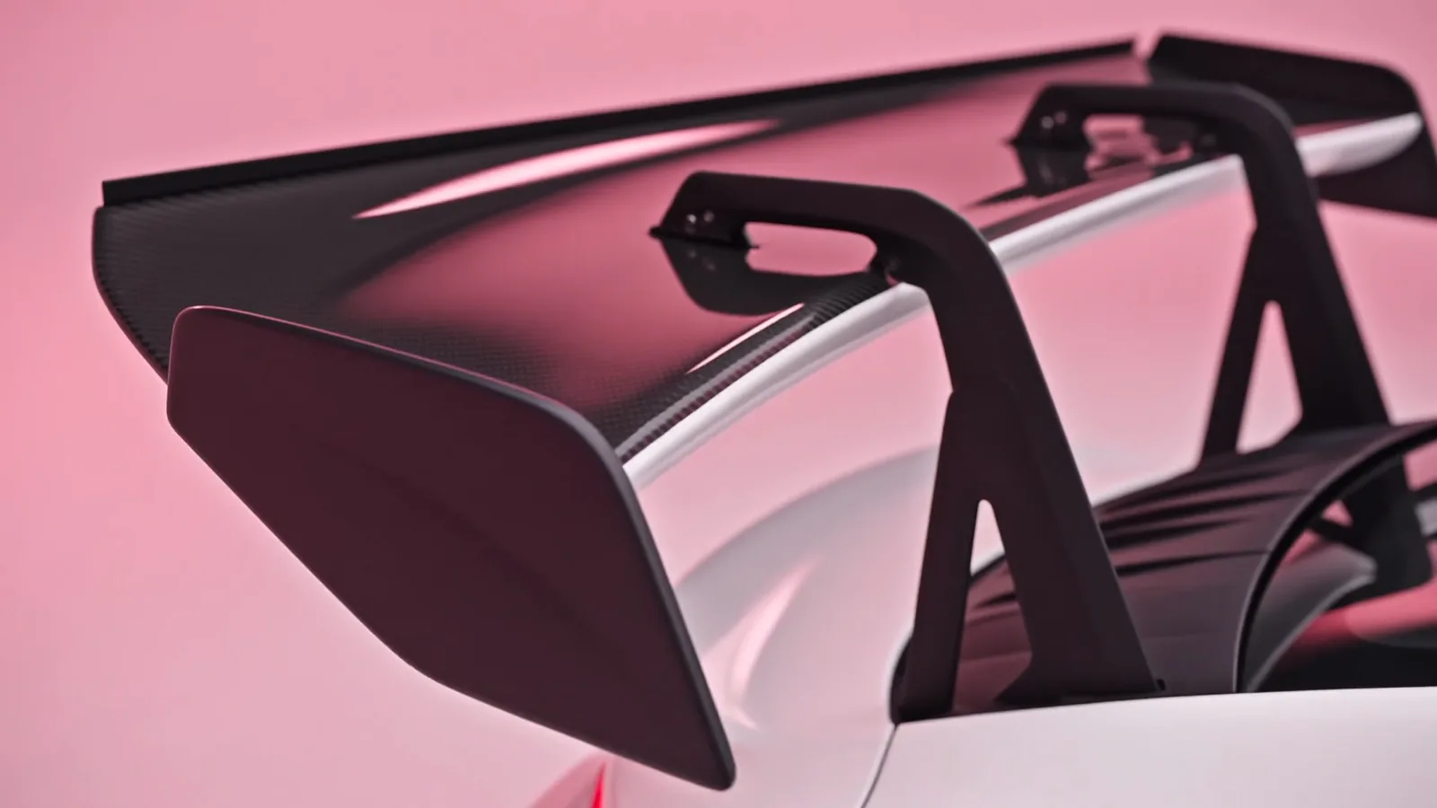 Close-up 3D render of a carbon fibre rear wing on a white sports car against a pink cyclorama