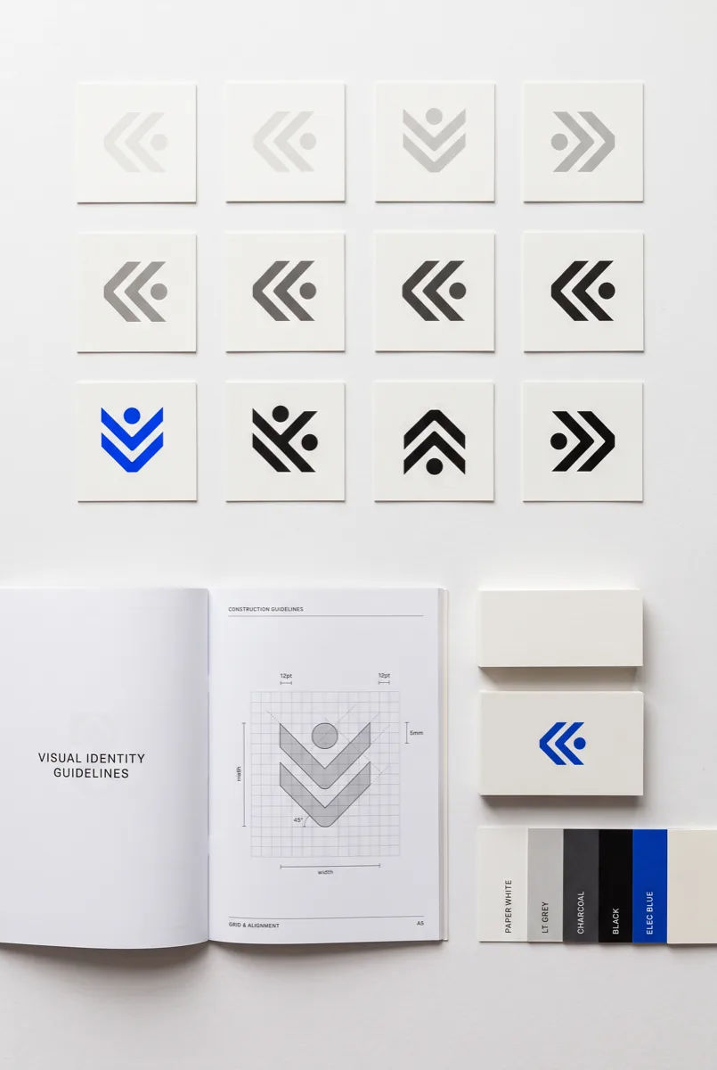 Printed visual identity guidelines with logo variations and a colour palette